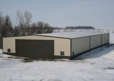 light yellow and brown steel barn